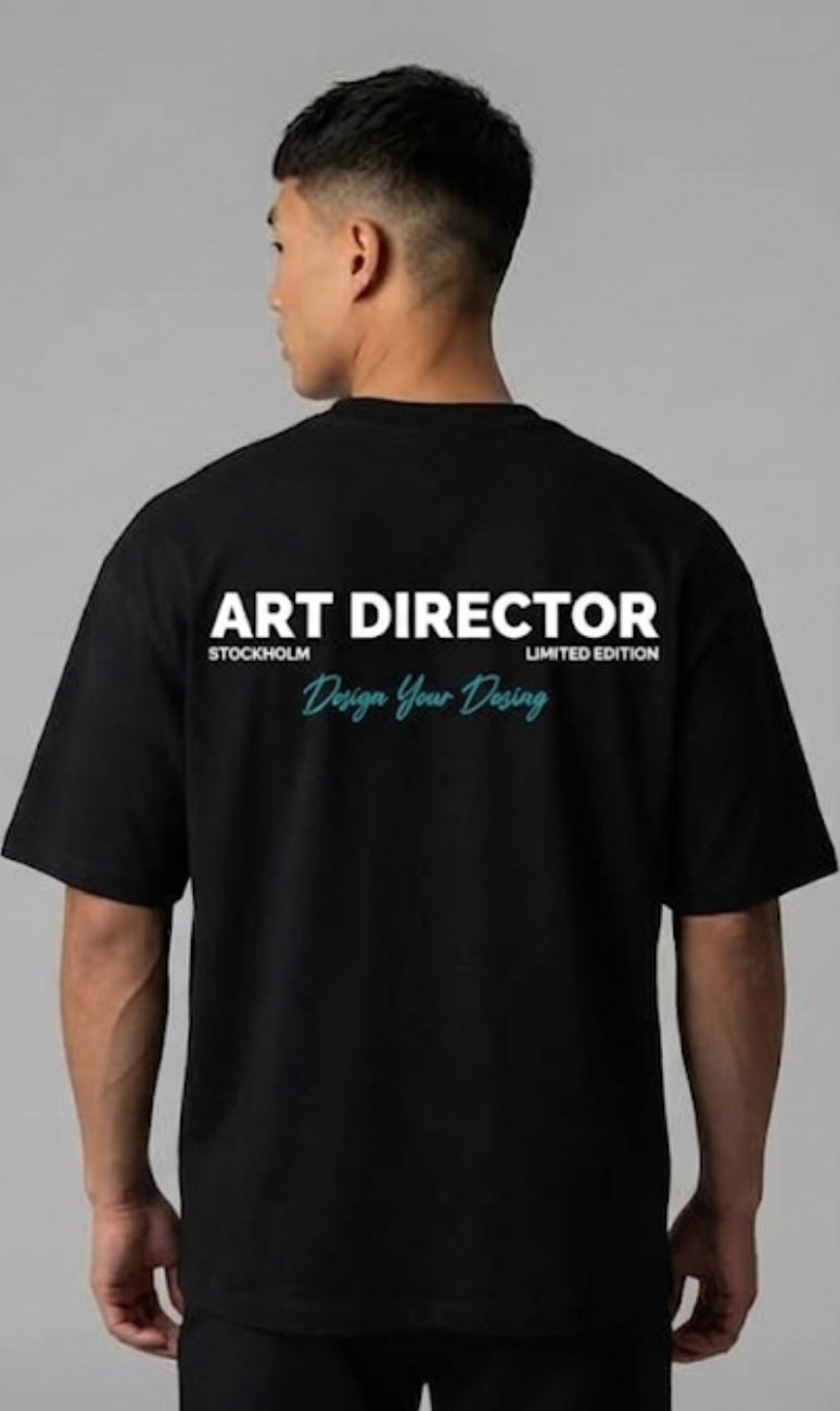 Model wearing the black ART DIRECTOR back print tee, Design Your Destiny artwork